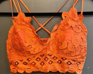 Anemone orange bralette. Size large. 
90% nylon 10% spandex.
Padding in bra.