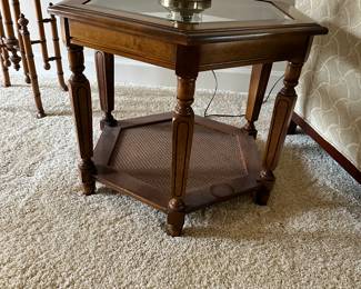 Mid 20th Century Walnut Hexagonal Glass Top Accent Table With Caned Shelf. 27.5ʺW × 23.75ʺD × 20.75ʺH
