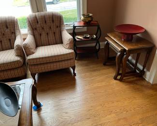 Wood nesting tables and upholstered tufted chairs