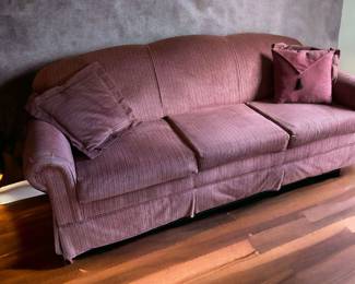 Plum Covered Sofa With Accent Pillows