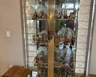 We have a complete set of Royal Daulton China in the Kingswood pattern, plus many Hummel figurines, and a contemporary glass and brass display cabinet with lighting.
