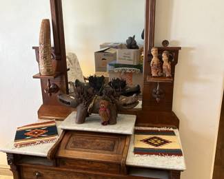 Renaissance Revival Walnut dresser with mirror and carrara marble tops.  Check out some of our African Art collection! 