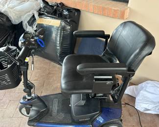 Jazzy motorized wheelchair and accessories.  Batteries work, $1200.