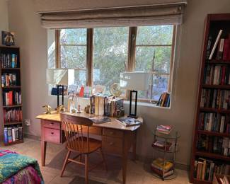 Copenhagen desk, bookshelves, and books.