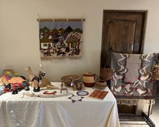 We have a fabulous collection of Lesotho Mohair tapesty weavings circa 1980 and fun and fanciful wood and basket pieces.