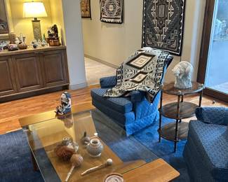 Teak bentwood coffee table with glass top, Crate and Barrel blue wool room size rug, part of our sampling of Navajo blankets, and a sampling of the many decorative pieces.