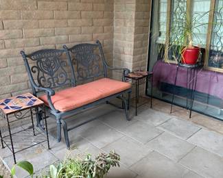 Great glider, house plants, and leaded glass panels with hanging hooks.