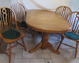 HUGE table  when engaging the 2 self storing leaves and 6 chairs. Lovely condition, practical and useful. Very substantial [ don't even think about it if you don't have help]--its heavy.