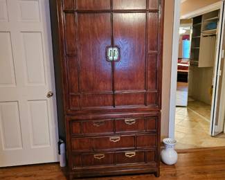 Large matching armoire with three drawers and brass trim