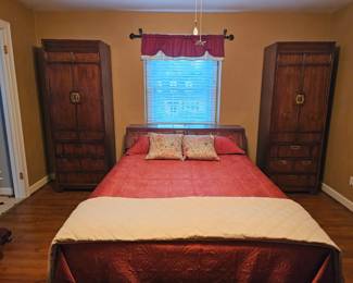 Queen size Thomasville bed including mattress and boxspring.  Headboard has storage area and electric outlet