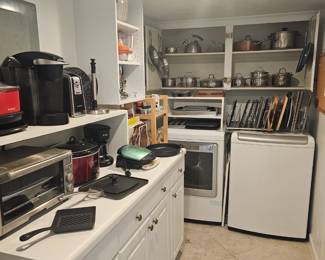 Utility room with small appliances and pots and pans