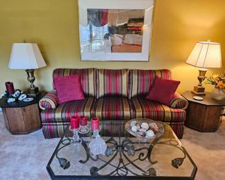 Three seater Vanguard Sofa with MCM hexagonal end tables with slate top.  Also wrought iron and beveled glass coffee table