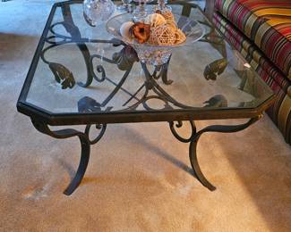 Heavy wrought iron coffee table with beveled glass top