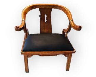 Front view of Jame Mont horse shoe chair