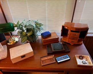 On top of the great office desk we have for sale, there is an assortment of Jewelry Boxes! Also, two sets of CROSSS Ink Pens in their original boxes! 