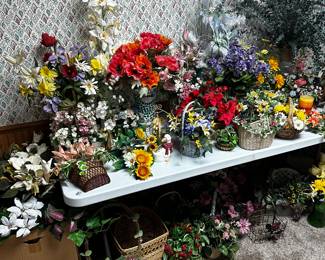 This is an 8ft banquet table filled with silk flower displays of every configuration! 