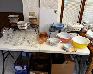 The kitchen is filled with everyday kitchen ware! BUT LOOK CLOSE and you will see all kinds of vintage items! Table FILLED with Vintage Pyrex and Stemware! 