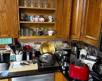 The kitchen is filled with everyday kitchen ware! BUT LOOK CLOSE and you will see all kinds of vintage items! (The main house appliance are NOT for sale! They re staying with the house!)