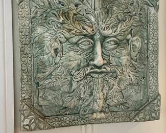 Wall hung north wind face plaque