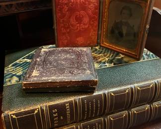 Antique books and daguerreotypes in original gold embossed leather frames 