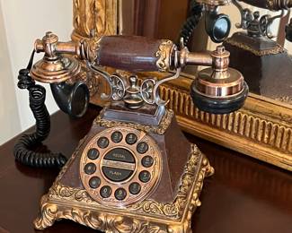 Old telephone in brass and wood
