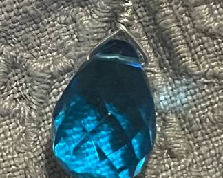 Huge London blue topaz briolette pendant on a sterling chain.