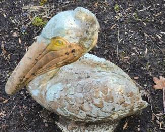 Concrete pelican garden statue