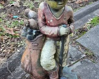 Concrete golfer statue