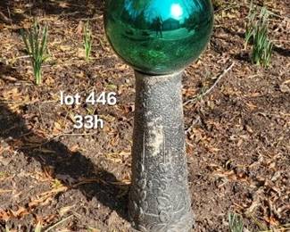 Glass gazing ball on concrete pedestal