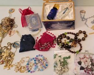 Collection of rosaries and holders