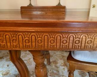 detail pressed oak on all dining room table and cabinetry