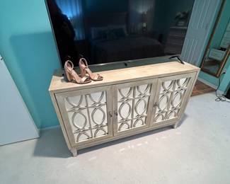 LIKE NEW FLAT SCREEN TV. SLIGHTLY USED CREDENZA STYLE CABINET WITH SHELVING FOR STORAGE