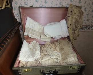 Antique baby and doll clothing and doilies.