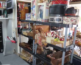 Shelves of new in boxes Raggety Ann and Andy dolls. Hat boxes, rabbits, gumball machines.