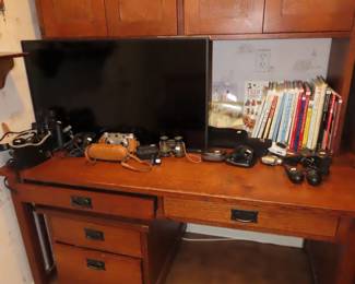 Two matching desks and hutches and one file cabinet.