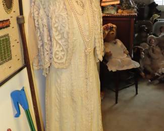 Vintage clothing and hats on manikin.