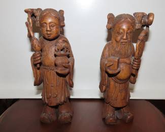 Carved wooden Asian figures.