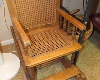 Caned childs chair.