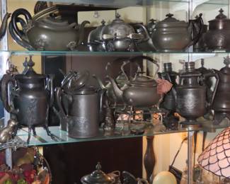 Pewter tea and coffee pots.