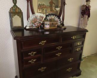 Cherry chest of drawers and mirror.