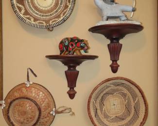 Baskets and Alaskan Inuit soapstone figures.