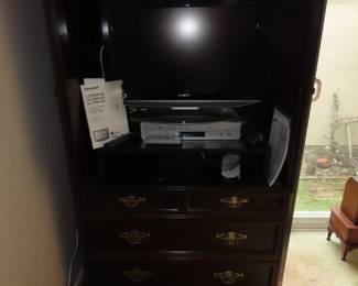 TV/clothing armoire.