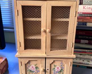 Small wooden curio hutch with flowers, missing a knob, has some wear 15"H x 10"W