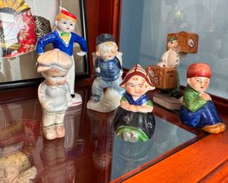 Group of small figurines, children, dutch couple, bellhop, most made in Japan or Occupied Japan 2-4"