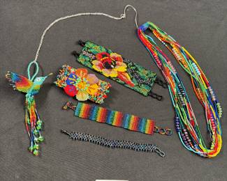 Jewelry Lot#1: Intricately beaded bracelets, multi-strand necklace and hummingbird 