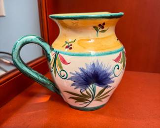 Ceramic pitcher with green handle, signed 5.5"H