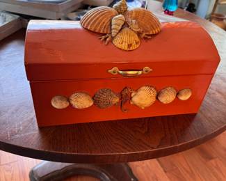 Painted ginger color, hinged wooden box with attached shells (small shell missing on top) 6"H x 12"L