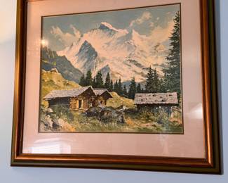 Mountain cabins at the foot of snowy mountains framed print 21" x 24"