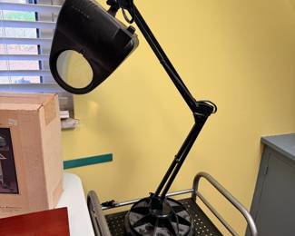 Weighted work lamp, does have a minor chip on side of base, works on initial test 25"H as seen in this position