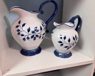 Blue and white ceramic pitchers, tallest is 5"H